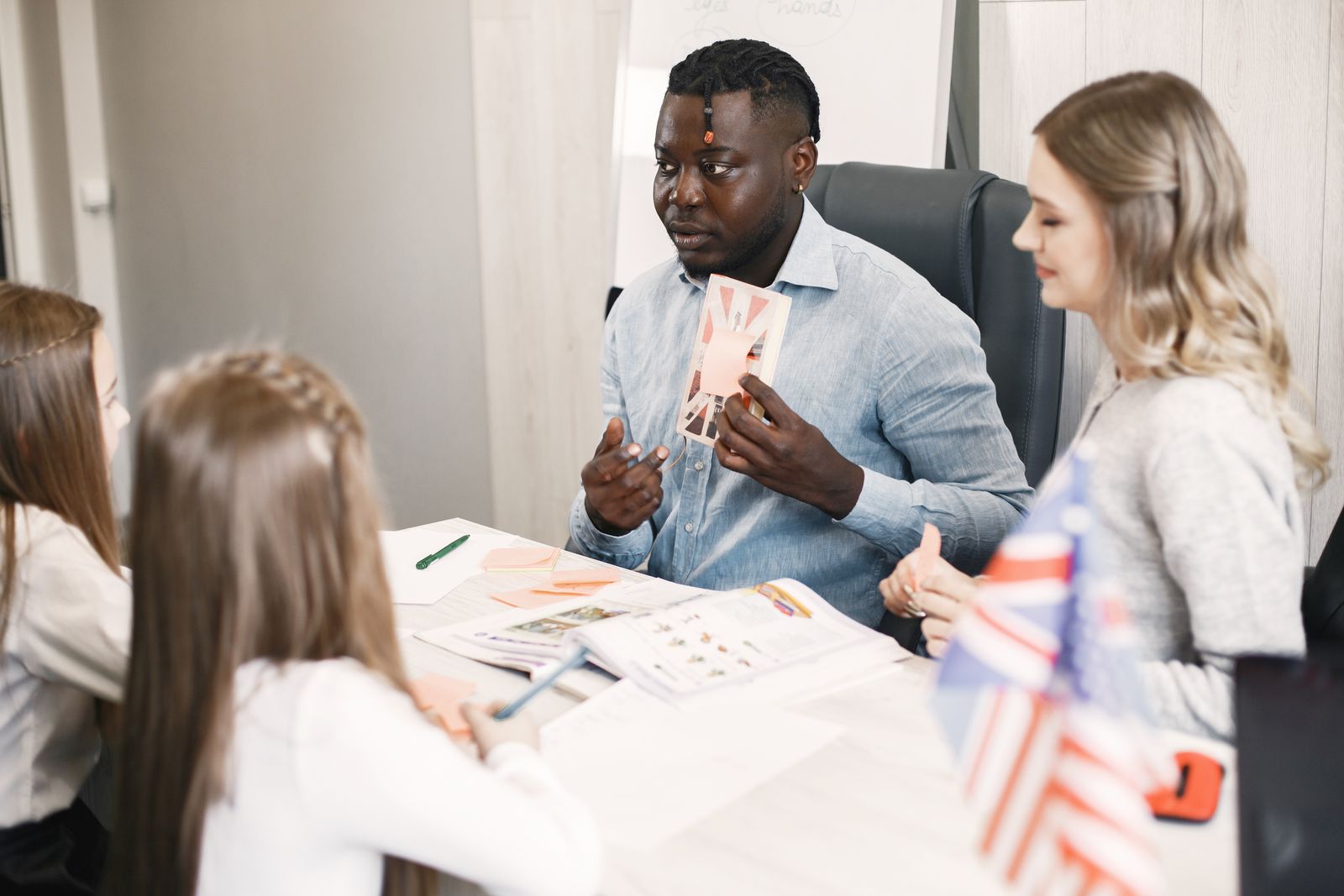 Teacher supporting young learners in an international classroom